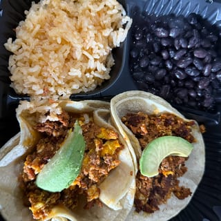 2 tacos eggw/ chorizo rice and beans